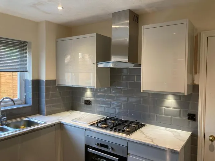 Recessed downlights and extractor wiring in a fitted kitchen