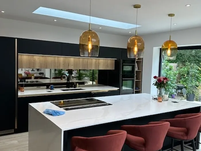Pendant lights installed over a kitchen island in a Bristol home