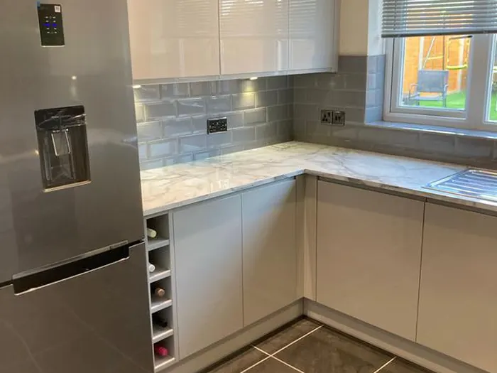 Under-cabinet lighting and worktop sockets in a modern kitchen